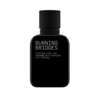 Black perfume bottle labeled 'Burning Bridges' on a white background