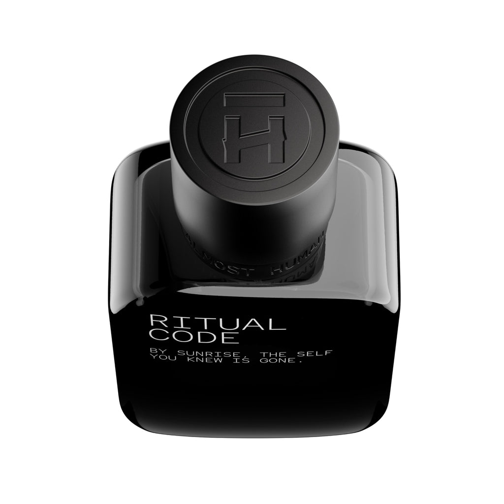 Black perfume bottle labeled 'Ritual Code' on a white background